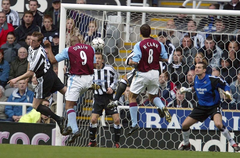 Aston Villa's Dion Dublin  scores  his goal against Newcastle during the Barclaycard Premiership match at St James' Park, Newcastle.  THIS PICTURE CAN ONLY BE USED WITHIN THE CONTEXT OF AN EDITORIAL FEATURE. NO WEBSITE/INTERNET USE UNLESS SITE IS REGISTERED WITH FOOTBALL ASSOCIATION PREMIER LEAGUE.   (Photo by Owen Humphreys - PA Images/PA Images via Getty Images)