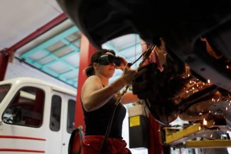 Toronto, Ontario - August 31, 2010: Jessica Gilbank, 37, owner of Ms. Lube fixes the brakes of a Lexus at the shop. ( Philip Cheung / for The National )