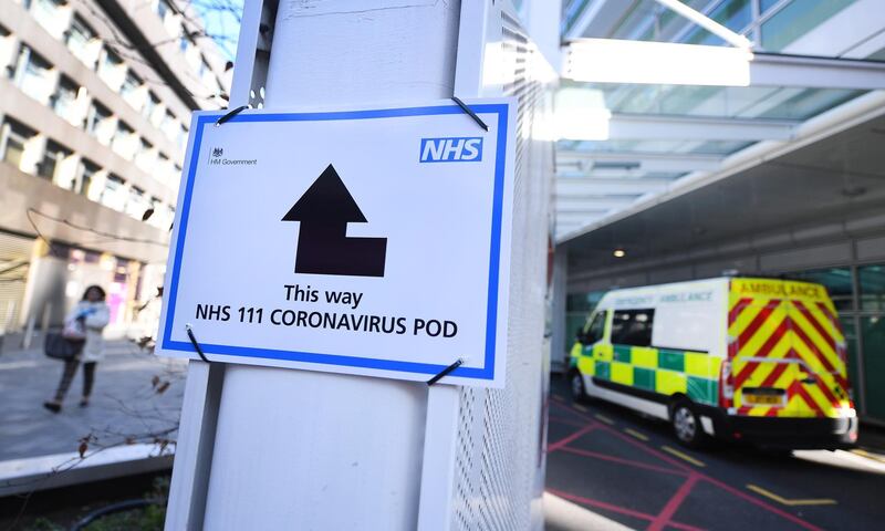 epa08320604 A sign indicates directions to a Coronavirus pod at a hospital in London, Britain, 25 March 2020. British Prime Minister Boris Johnson has announced that Britons can only leave their homes for essential reasons or may be fined, in order to reduce the spread of the Coronavirus.  EPA/ANDY RAIN