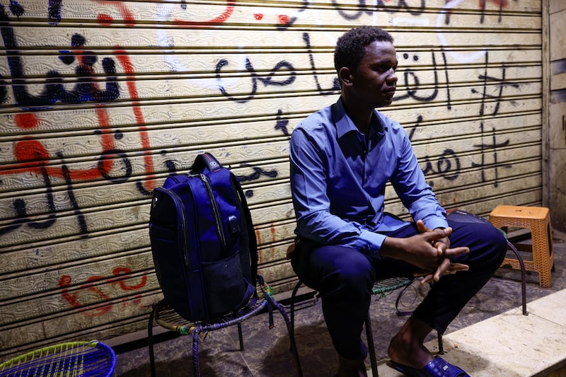Mostafa waits for the bus before leaving for Egypt in Khartoum, Sudan September 24, 2022. Reuters