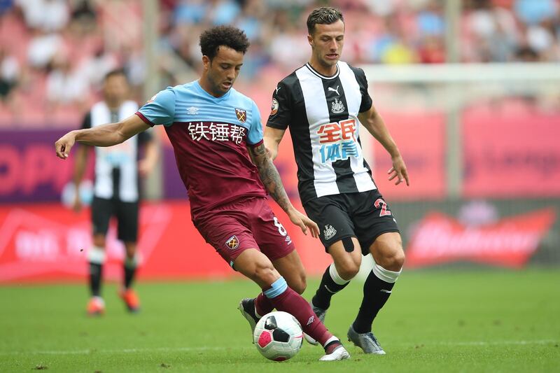 SHANGHAI, CHINA - JULY 20:  Jonjo Shelvey of Newcastle United competes the ball with Felipe Anderson of West Ham United during the Premier League Asia Trophy 2019 match between West Ham United and Newcastle United at Shanghai Hongkou Stadium on July 20, 2019 in Shanghai, China.  (Photo by Lintao Zhang/Getty Images for Premier League)