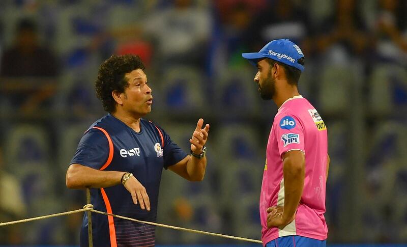 Mumbai Indians mentor Sachin Tendulkar (L) interacts with Rajasthan Royals captain Ajinkya Rahane before the 2018 Indian Premier League (IPL) Twenty20 cricket match between Mumbai Indians and Rajasthan Royals at the Wankhede Stadium in Mumbai on May 13, 2018. (Photo by INDRANIL MUKHERJEE / AFP) / ----IMAGE RESTRICTED TO EDITORIAL USE - STRICTLY NO COMMERCIAL USE----- / GETTYOUT