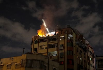 Flames and smoke rise from the house of a senior Islamic Jihad commander after Israeli air strikes in Gaza on Tuesday. EPA