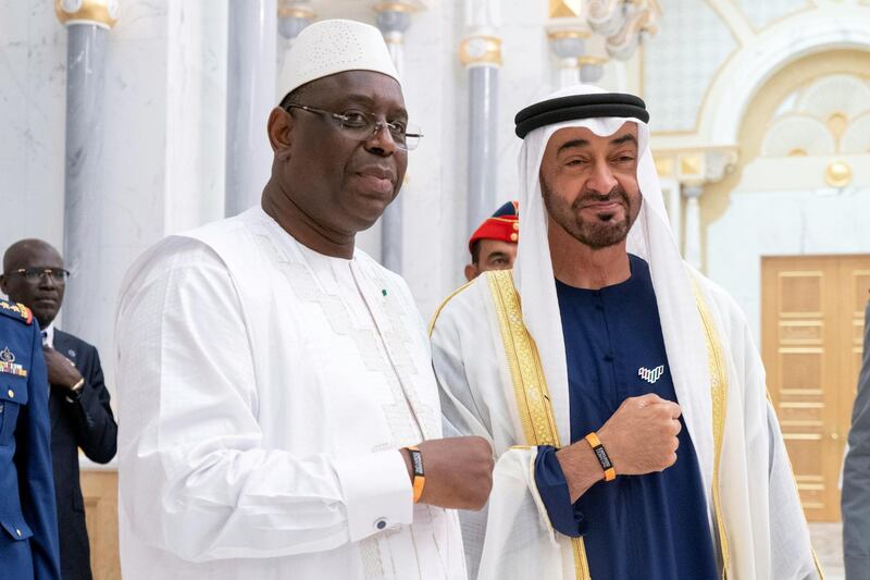 ABU DHABI, UNITED ARAB EMIRATES - February 06, 2020: HH Sheikh Mohamed bin Zayed Al Nahyan, Crown Prince of Abu Dhabi and Deputy Supreme Commander of the UAE Armed Forces (R) and HE Macky Sall, President of Senegal (L), stand for a photograph wearing EXPO 2020 wristband, during an official visit, at Qasr Al Watan.   

( Rashed Al Mansoori / Ministry of Presidential Affairs )
---