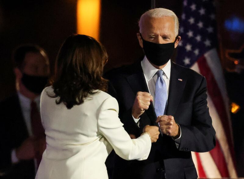 US president-elect Joe Biden and vice president-elect Kamala Harris gesture during their post-election rally in Wilmington, Delaware. Reuters