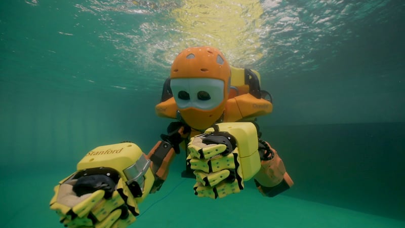 The robot is controlled by a team on the surface, and has collected plastic bottles from mock coral reefs placed in a pool during trials in Abu Dhabi