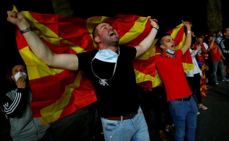 Supporters of North Macedonia celebrate their win outside the Duisburg stadium. Reuters