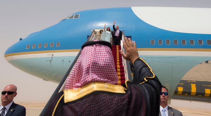 A handout picture provided by the Saudi Royal Palace on May 22, 2017, shows US President Donald Trump and First Lady Melania Trump waving as they board Air Force One before leaving Riyadh to Israel. (Photo by BANDAR AL-JALOUD / Saudi Royal Palace / AFP) / RESTRICTED TO EDITORIAL USE - MANDATORY CREDIT "AFP PHOTO / SAUDI ROYAL PALACE / BANDAR AL-JALOUD" - NO MARKETING - NO ADVERTISING CAMPAIGNS - DISTRIBUTED AS A SERVICE TO CLIENTS