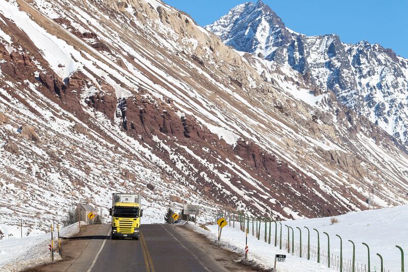 Vehicles cross the Cristo Redentor international land border between Argentina and Chile at Los Andes, Mendoza, Argentina. It was closed two weeks ago because of harsh weather conditions. Reuters
