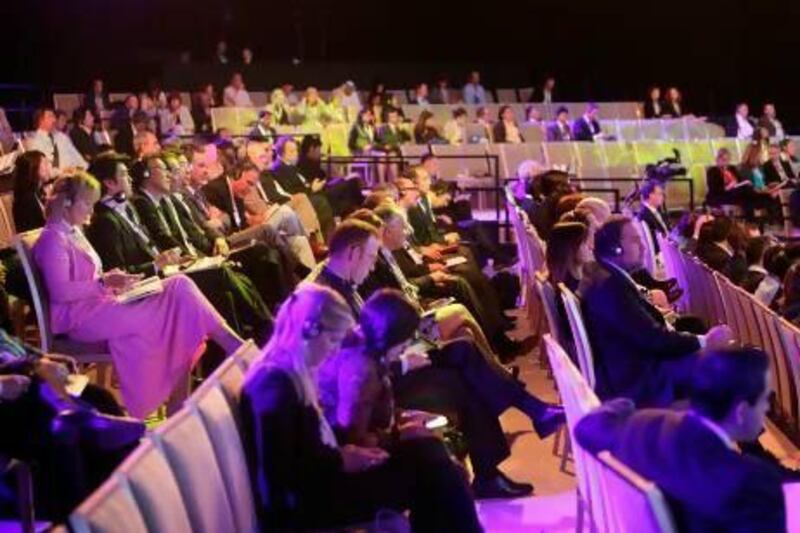 Spectators watch a panel discussion at the World Travel and Tourism Council summit in Abu Dhabi. Sammy Dallal / The National