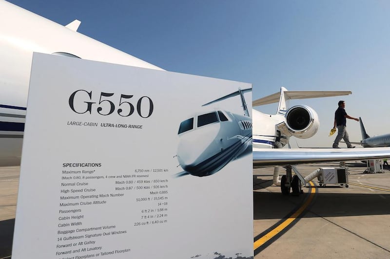 The Gulfstream G550 jet gets a dusting from a worker during the second day at the Abu Dhabi Air Expo at Al Bateen Executive Airport. Delores Johnson / The National