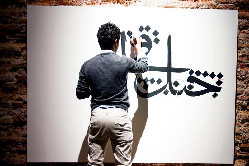 Photos by Sofia Dadurian for an A&L cover story (June 2013) by David D'Arcy on the Venice Bienale.  Artist Nasser alSalem (or it could be Nasser Salem. You need to double check with the author) creates a work of calligraphy at "Rhizomas: Generation in Waiting,' and exhibition of Young Artists from Saudi Arabia. CREDIT: Sofia Dadurian
