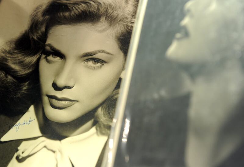 A signed photograph of Lauren Bacall. AFP PHOTO / GABRIEL BOUYS / Files 

