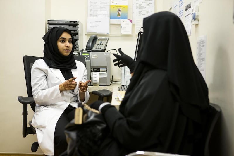 Resident doctor Khulood Ali Al Suwaidi advises a patient at the Corniche Hospital in Abu Dhabi. Christopher Pike / The National