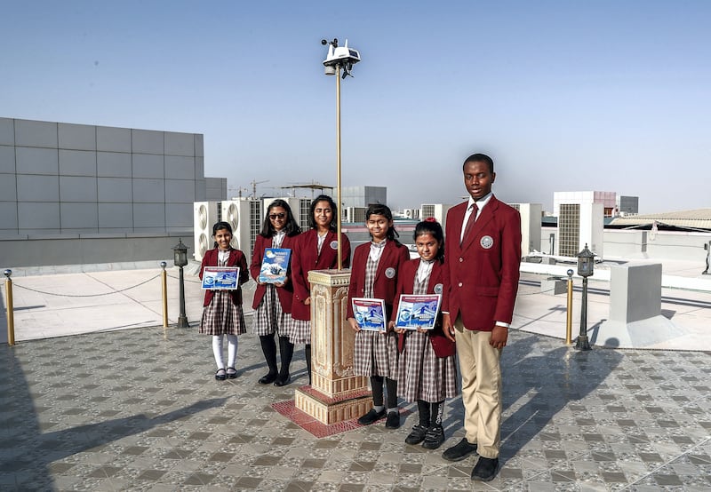 Abu Dhabi, U.A.E., October 11, 2018. ADEK has ranked four schools as outstanding this year. Merryland School is on the list for the first time. --  Students at the roofdeck weather station.Victor Besa / The NationalSection:  NAReporter:  Anam Rizvi