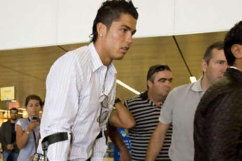 Cristiano Ronaldo leaves Amsterdam's Schiphol Airport after his ankle operation on Tuesday.