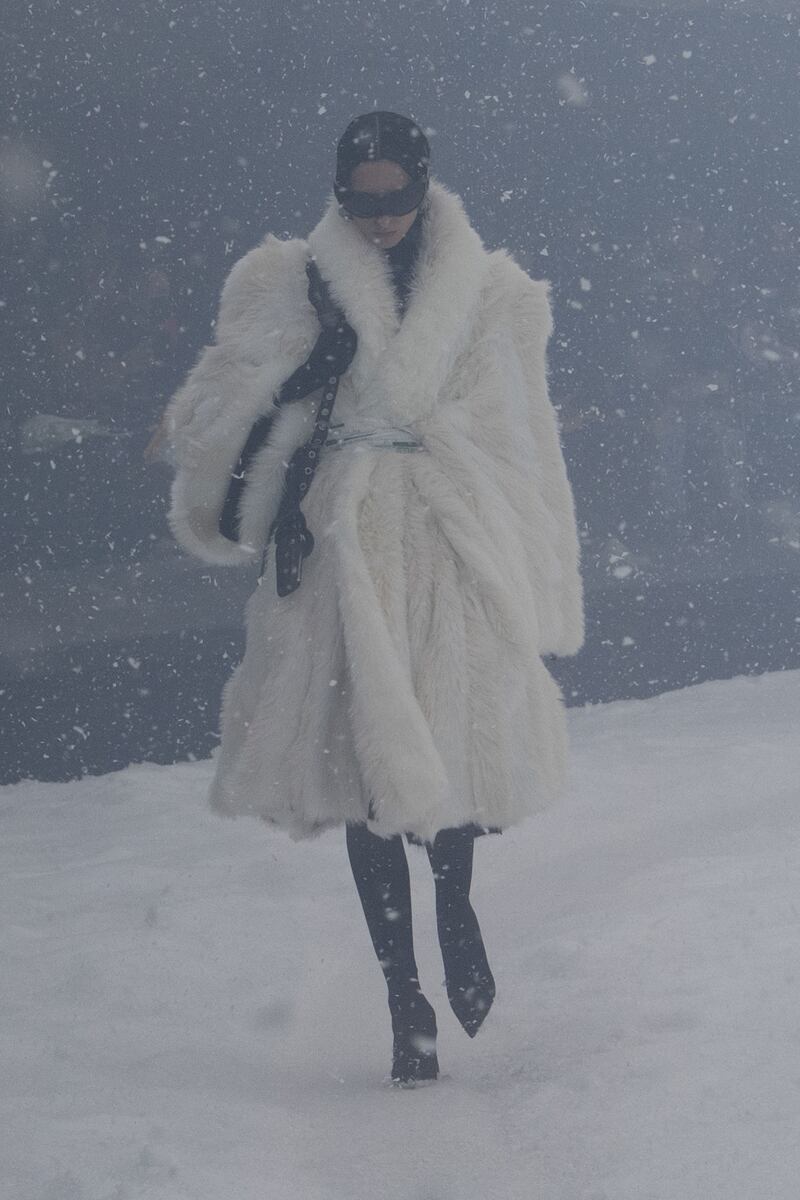 A model wearing a huge, faux-fur coat.