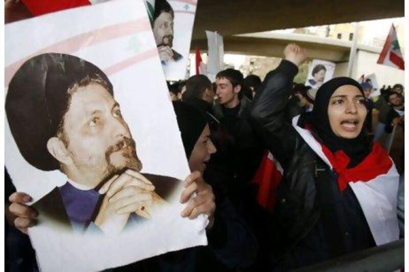 Protesters shout slogans as they carry posters of Imam Mousa Al Sadr during a demonstration at the UN headquarters in Beirut, in February. Sharif Karim / Reuters