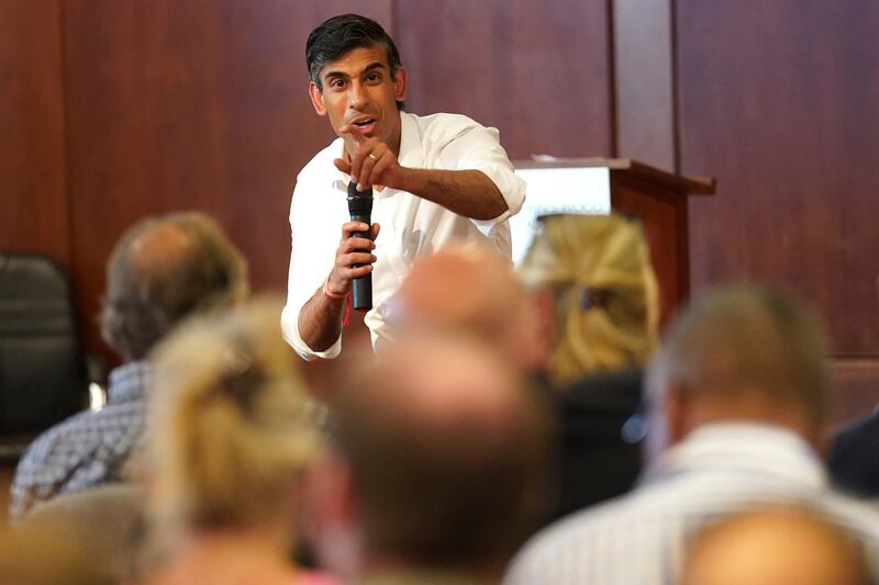 Rishi Sunak talks during a visit to St John's Wood Synagogue on Wednesday. AP