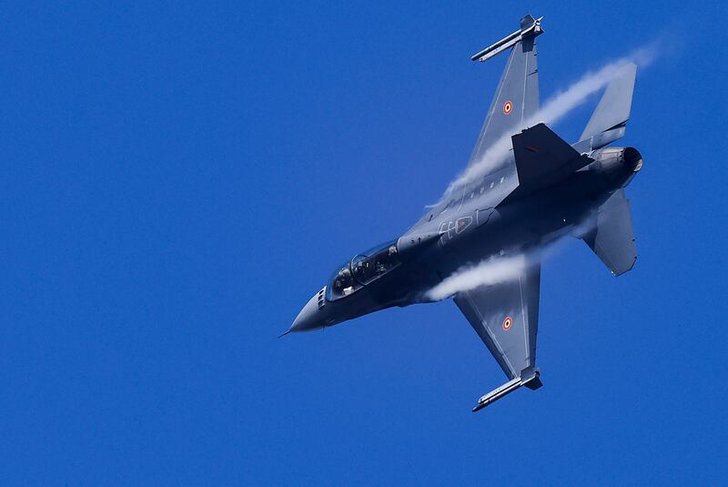 A Belgian F-16 jet fighter over Kleine-Brogel Air Base, about 130km north-east of Brussels. AFP