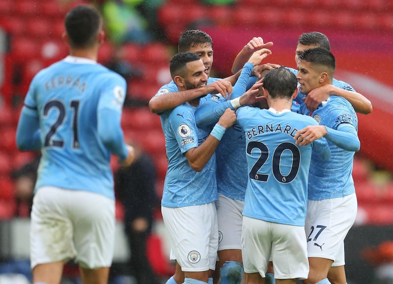 SHEFFIELD, ENGLAND - OCTOBER 31: Kyle Walker of Manchester City celebrates with teammates after scoring his team's first goal during the Premier League match between Sheffield United and Manchester City at Bramall Lane on October 31, 2020 in Sheffield, England. Sporting stadiums around the UK remain under strict restrictions due to the Coronavirus Pandemic as Government social distancing laws prohibit fans inside venues resulting in games being played behind closed doors. (Photo by Catherine Ivill/Getty Images)