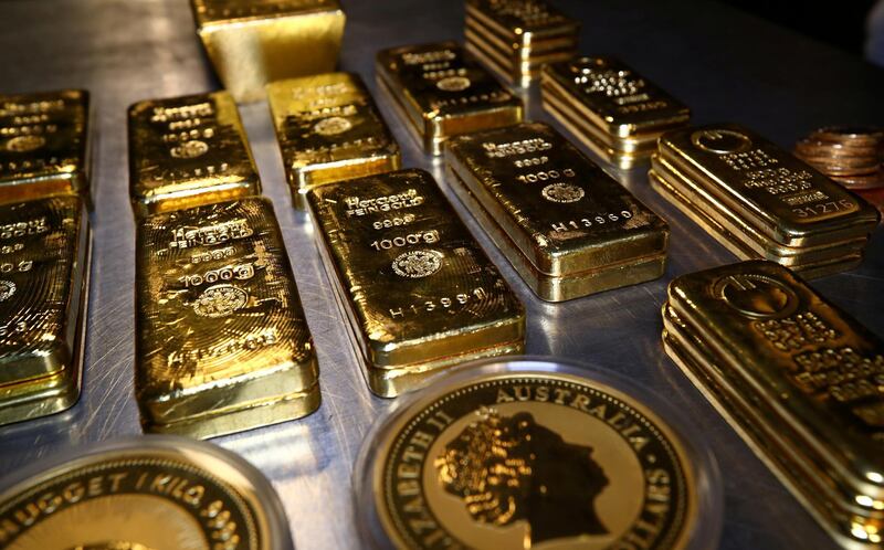 FILE PHOTO: Gold bars and coins stacked in the safe-deposit boxes room of the Pro Aurum gold house in Munich, Germany,  August 14, 2019. REUTERS/Michael Dalder/File Photo