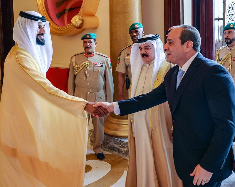 King Hamad with Sheikh Nasser bin Hamad, commander of Bahrain's Royal Guard and President of the Bahrain Olympic Committee, as he greets Mr El Sisi in Manama. AFP