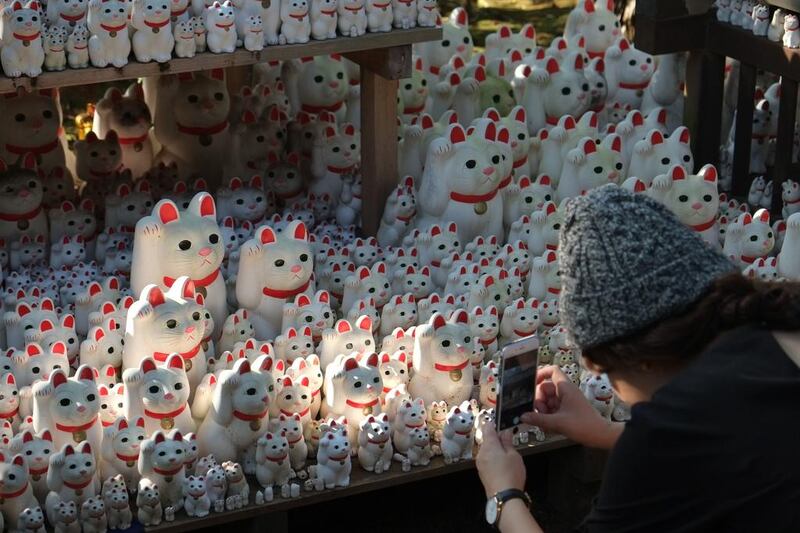 “Maneki neko” or beckoning cat ornaments are seen on display at Gotokuji Temple in Tokyo. The figures are believed to be a lucky charm, commonly found at temples across Japan, and are sold as popular souvenirs. Kazuhiro Nogi / AFP