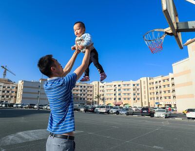 Dubai, U.A.E., Janualry 7, 2019.   Neighborhood Series, International City.  James Yang, a China Cluster resident takes his son Shicheng- 2 years old for an early morning stroll at the basketball courts.
Victor Besa / The National
Section:  NA
Reporter:  Ramola Talwar