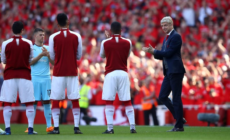 LONDON, ENGLAND - MAY 06:  Arsene Wenger walks out to a guard of honnor. Clive Mason / Getty Images