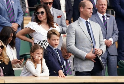 The Prince of Wales with Prince George and Princess Charlotte during the Wimbledon final. 