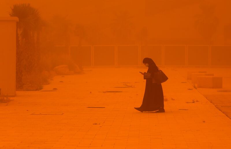 The sandstorm turns a street orange. AFP