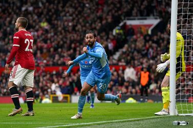 Manchester City's Bernardo Silva celebrates scoring the second goal of the game past Manchester United goalkeeper David de Gea during the Premier League match at Old Trafford, Manchester. Picture date: Saturday November 6, 2021.