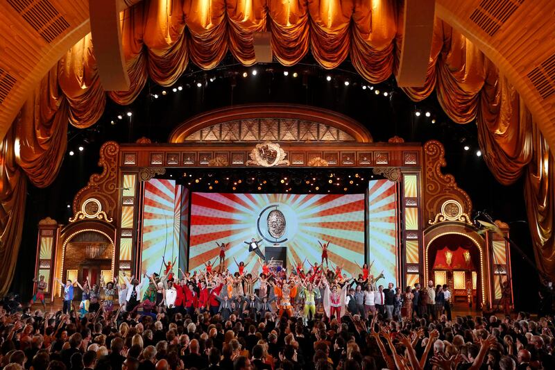 Host Neil Patrick Harris, hanging from a large replica of the Tony Award,  performs during the opening number of American Theatre Wing's annual Tony Awards in New York June 9, 2013. REUTERS/Lucas Jackson (UNITED STATES - Tags: ENTERTAINMENT) (TONYS-SHOW) *** Local Caption ***  AAL167_STAGE-TONYAW_0610_11.JPG