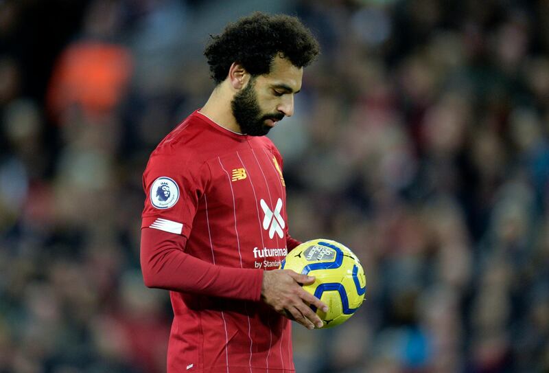 Mohamed Salah prepares himself for a penalty kick against Tottenham at Anfield. EPA