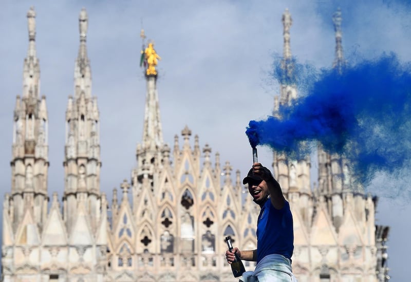 Inter Milan fans celebrate winning Serie A outside the Duomo di Milano. Reuters