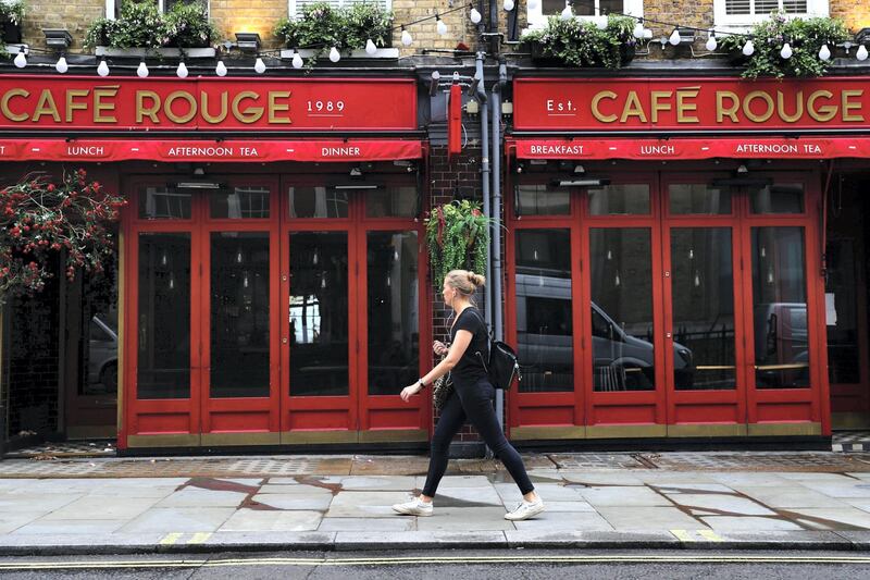 A pedestrian passes a closed Cafe Rouge restaurant, operated by Casual Dining Group Ltd., in London, U.K., on Thursday, July 9, 2020. British shops aren't getting much of a boost from newly reopened bars, cafes and restaurants as customers prefer to stay away. Photographer: Simon Dawson/Bloomberg