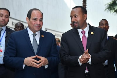 epa07358385 Egyptian President Abdel Fattah al-Sisi (L) and Prime Minister of Ethiopia Abiy Ahmed (R) chat during the 32nd African Union Summit in Addis Ababa, Ethiopia, 10 February 2019. African heads of state and business leaders are gathering in Ethiopian capital for a two-day summit under the theme 'Refugees, Returnees and Internally Displaced Persons: Towards Durable Solutions to Forced Displacement in Africa'.  EPA/STRINGER