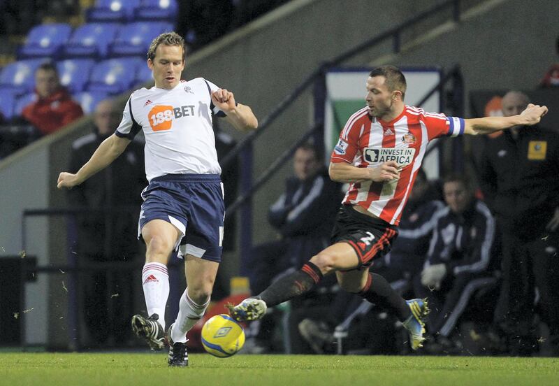 Bolton Wanderers' Kevin Davies and Sunderlands Phil Bardsley (right) during the FA Cup Third Round match at the Reebok Stadium, Bolton.   (Photo by Peter Byrne/PA Images via Getty Images)