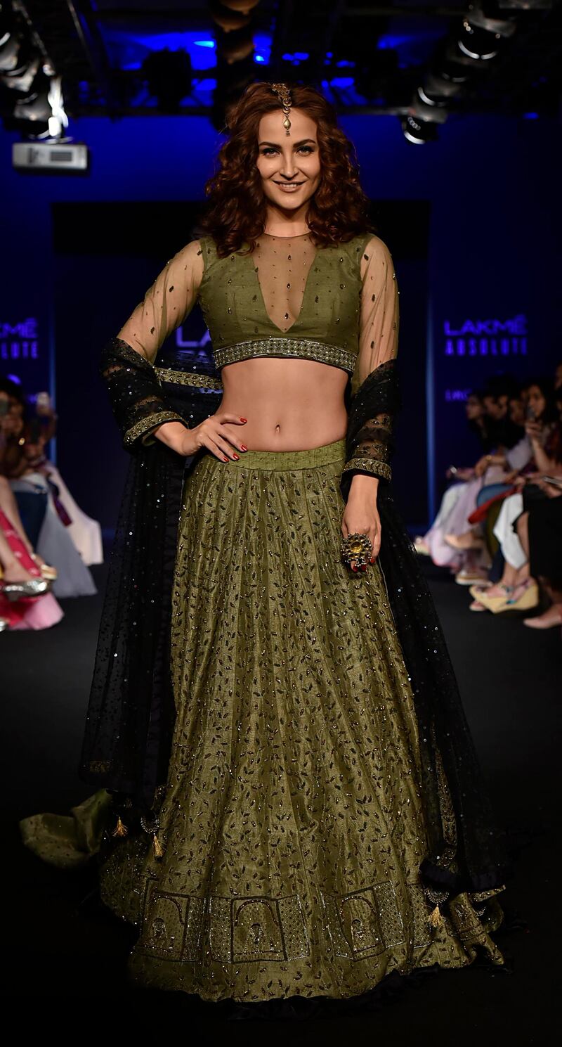 Actress Elli Avram showcases a creation by designer Ekta. AFP