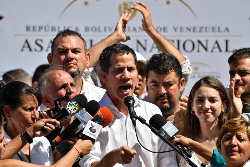 Venezuela's National Assembly president Juan Guaido speaks before a crowd of opposition supporters during an open meeting in Vargas, Venezuela, on January 13, 2019. The president of the opposition-controlled but sidelined National Assembly was released less than an hour after being arrested by Venezuelan intelligence agents on Sunday, his wife said. Guaido had directly challenged the legitimacy of Nicolas Maduro as the president was sworn in for a second term on Thursday, calling for a transitional government ahead of new elections.
 / AFP / Yuri CORTEZ
