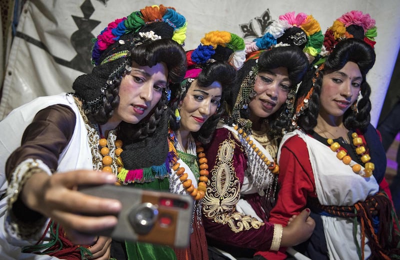 Berber women pose for a selfie during the Engagement Moussem. Photo: Fadel Senna / AFP