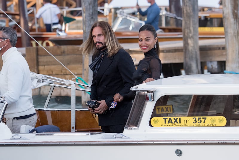 Zoe Saldana and Marco Perego arrive at the Dolce & Gabbana Alta Moda show in Venice, Italy. Getty Images