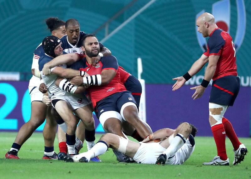 Billy Vunipola, third from left, of England in action during the Rugby World Cup clash against USA at Kobe Misaki Stadium. EPA