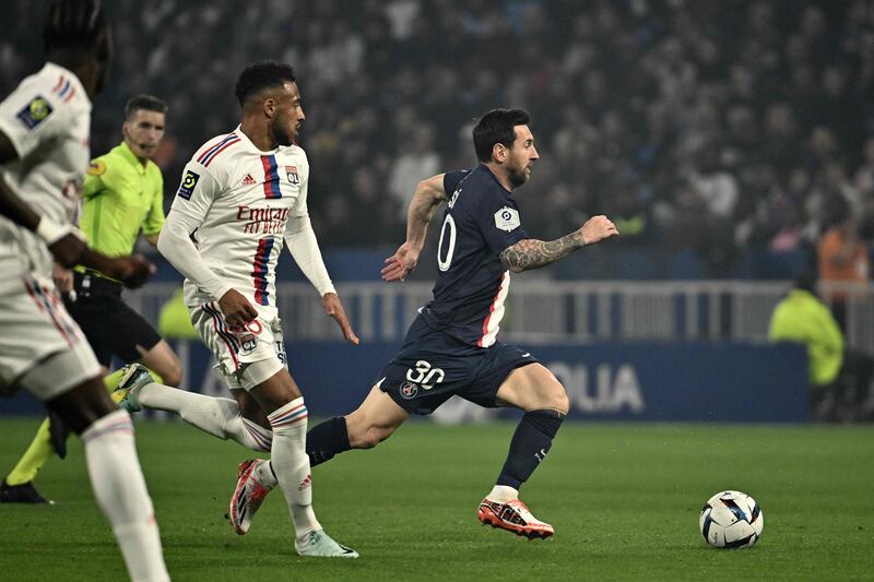 Paris Saint-Germain's Argentine forward Lionel Messi runs with the ball during the French Ligue 1 match against Olympique Lyonnais at The Groupama Stadium in Decines-Charpieu, central-eastern France, on September 18, 2022.  AFP
