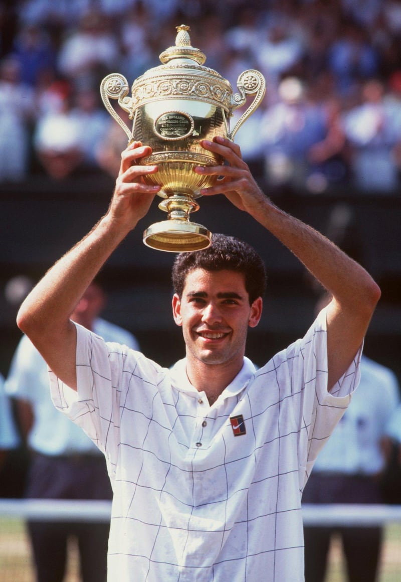 9 JUL 1995:  PETE SAMPRAS OF THE UNITED STATES HOLDS UP THE TROPHY AFTER DEFEATING BORIS BECKER OF GERMANY IN THE MENS FINAL AT WIMBLEDON. SAMPRAS WON THE MATCH 6-7 (2-7), 6-2, 6-4, 6-2.  Mandatory Credit: Clive Brunskill/ALLSPORT