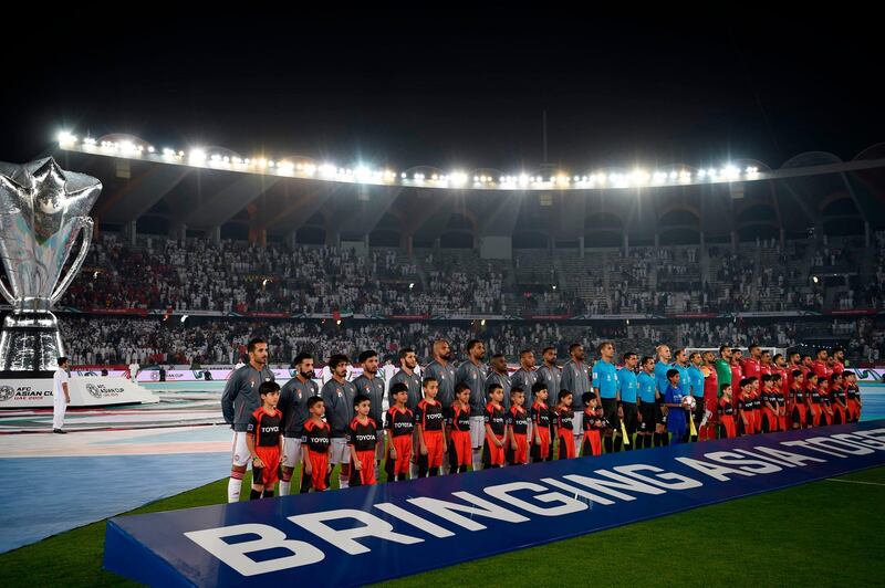 Players stand on the pitch prior to the game between United Arab Emirates and Bahrain. AFP