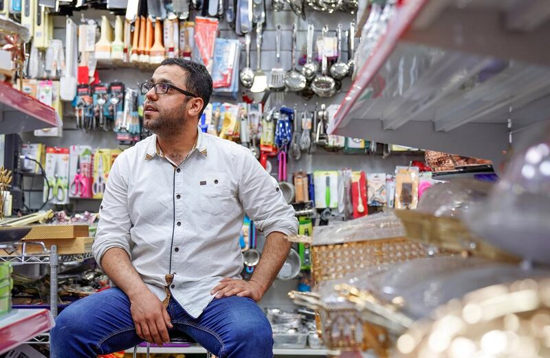 Abu Dhabi, United Arab Emirates, July 17, 2019.  Vendors of Al Mina Photo Project.  Al Mina Souk Market -- Shop manager, Mohammed Soleimani, 30, from Iran.
Victor Besa/The National
Section:  NA
Reporter: