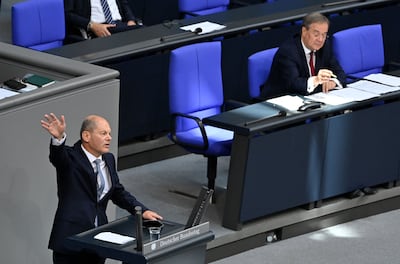 Social Democrat candidate Olaf Scholz, left, and Christian Democrat nominee Armin Laschet, right, during a parliamentary debate in Berlin. AFP