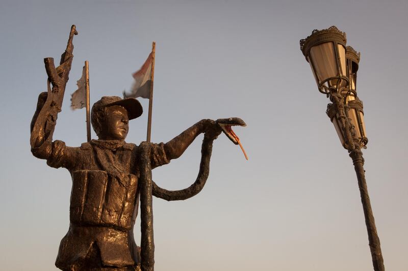 A statue symbolising the fight against the Islamic State can be see near military hospital run by the Hashd al-Shaabi in Basra, a major city in southern Iraq.